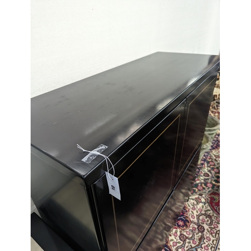 47 - A 20th century black lacquer four door side cabinet, width 115cm, depth 45cm, height 135cm