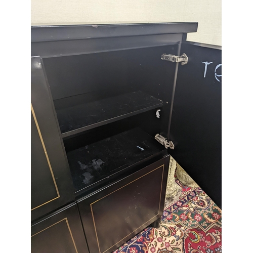 47 - A 20th century black lacquer four door side cabinet, width 115cm, depth 45cm, height 135cm