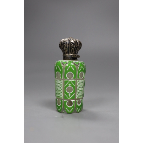 476 - A Victorian silver mounted green and white overlaid glass scent bottle,10cms high,