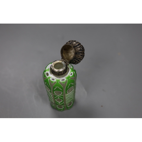 476 - A Victorian silver mounted green and white overlaid glass scent bottle,10cms high,