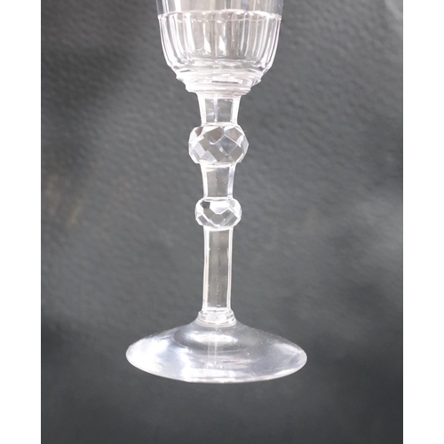 477 - An 18th century facet stemmed ale glass,22.5cms high,