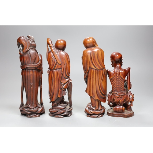 487 - Four Chinese boxwood figures of a luohan and three immortals, early 20th century,  tallest 20cm high... 