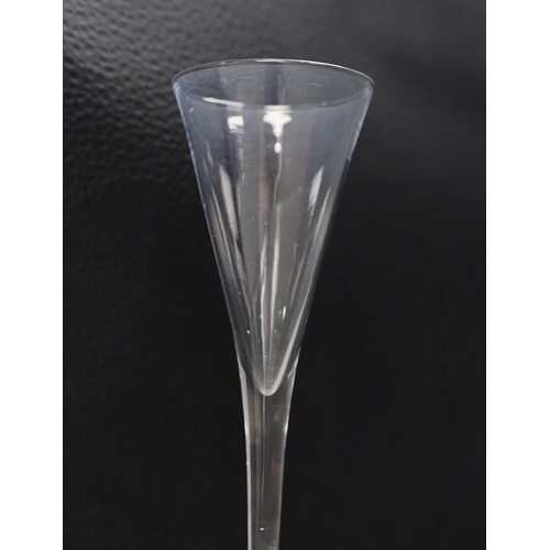 488 - An 18th century toasting glass, 19cms high,