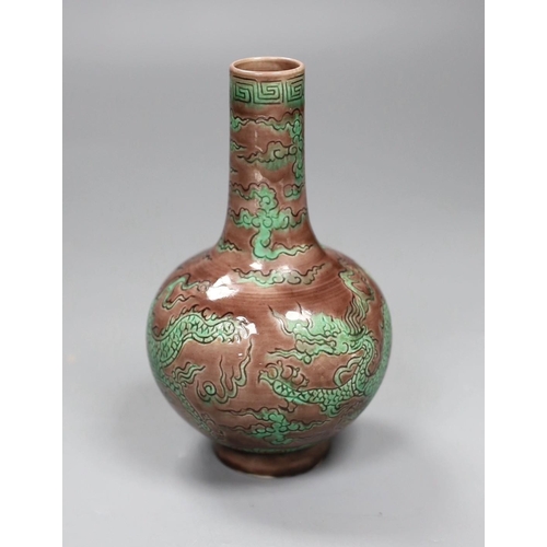 504 - A Chinese aubergine and green glazed 'dragon' bottle vase, 14cm tall