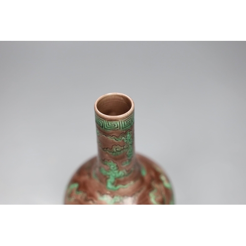 504 - A Chinese aubergine and green glazed 'dragon' bottle vase, 14cm tall