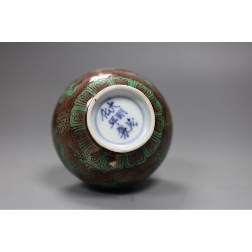 504 - A Chinese aubergine and green glazed 'dragon' bottle vase, 14cm tall