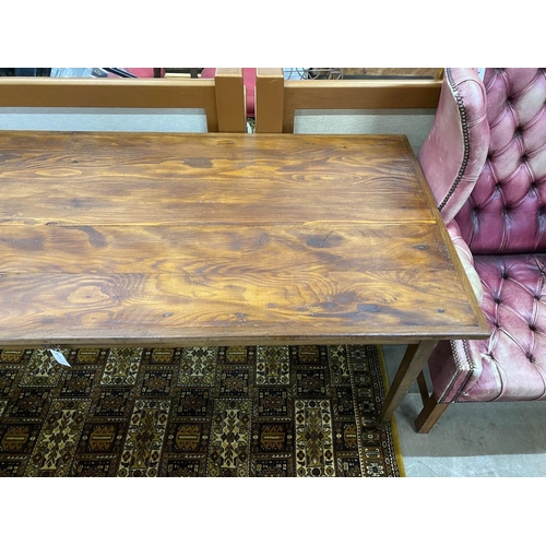 52 - A rectangular French style oak kitchen table from a factory in France, length 204cm, depth 85cm, hei... 