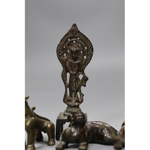 538 - Five Chinese or Tibetan bronze figures or Buddhist implements, tallest 13cms high,