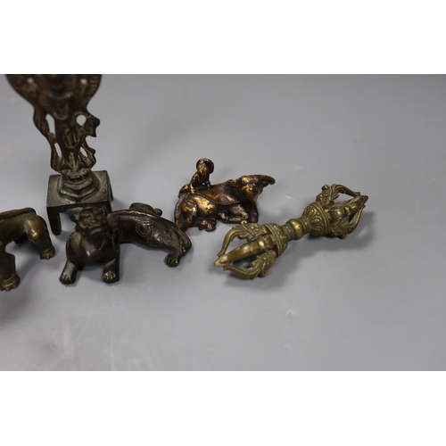 538 - Five Chinese or Tibetan bronze figures or Buddhist implements, tallest 13cms high,