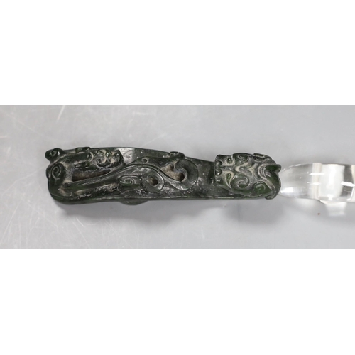 541 - A Chinese rock crystal belt hook and a Chinese spinach green jade belt hook (2), largest 12cms long,... 