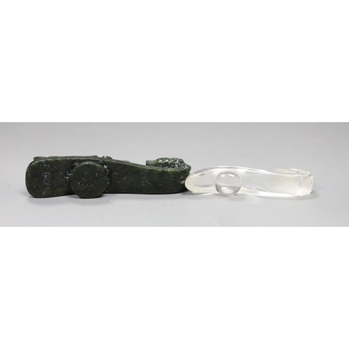 541 - A Chinese rock crystal belt hook and a Chinese spinach green jade belt hook (2), largest 12cms long,... 