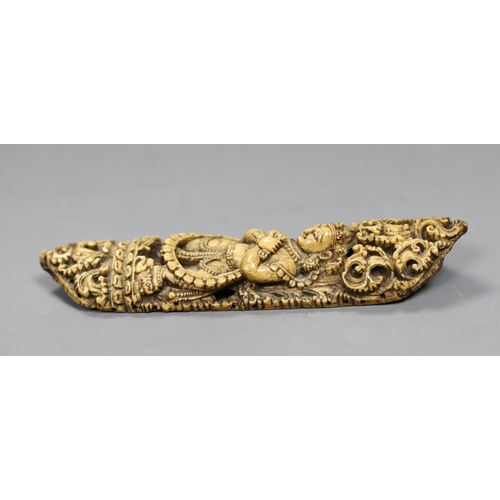 547 - A 19th century Burmese bone carving of a Buddhist deity, 15cm tall