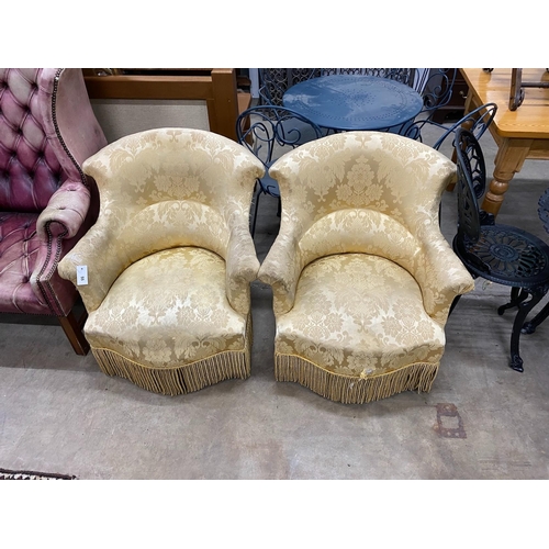 55 - A pair of late Victorian upholstered tub framed armchairs