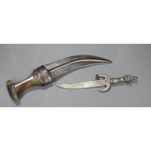 554 - An Arab jambiya white metal dagger and one other ceremonial dagger