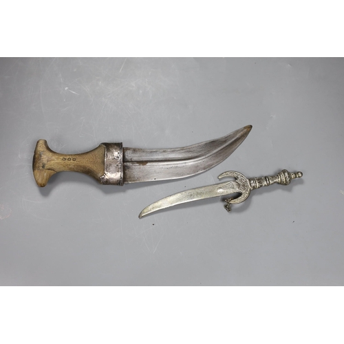 554 - An Arab jambiya white metal dagger and one other ceremonial dagger