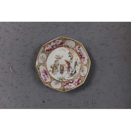 559 - A group of four 18th century Chinese export famille rose saucers,