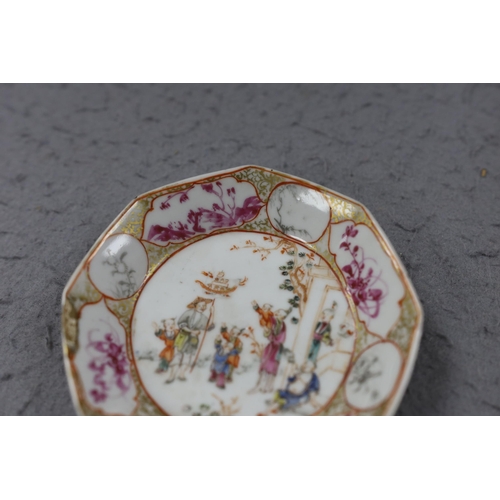 559 - A group of four 18th century Chinese export famille rose saucers,