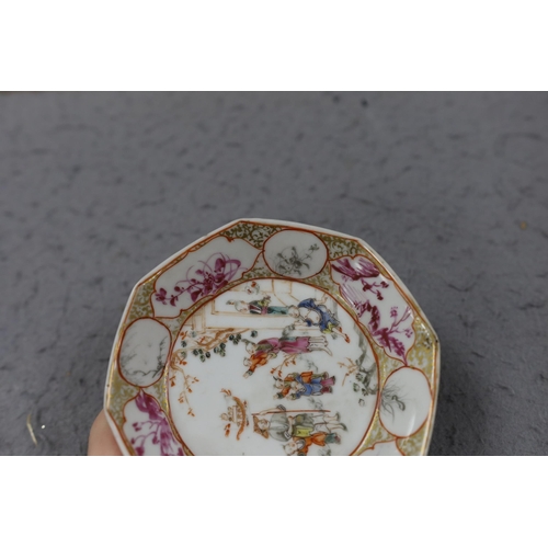 559 - A group of four 18th century Chinese export famille rose saucers,