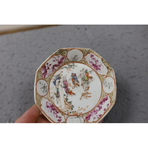 559 - A group of four 18th century Chinese export famille rose saucers,