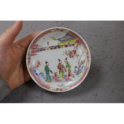 559 - A group of four 18th century Chinese export famille rose saucers,