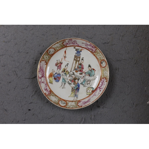 559 - A group of four 18th century Chinese export famille rose saucers,