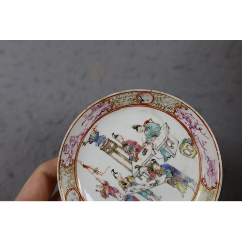 559 - A group of four 18th century Chinese export famille rose saucers,