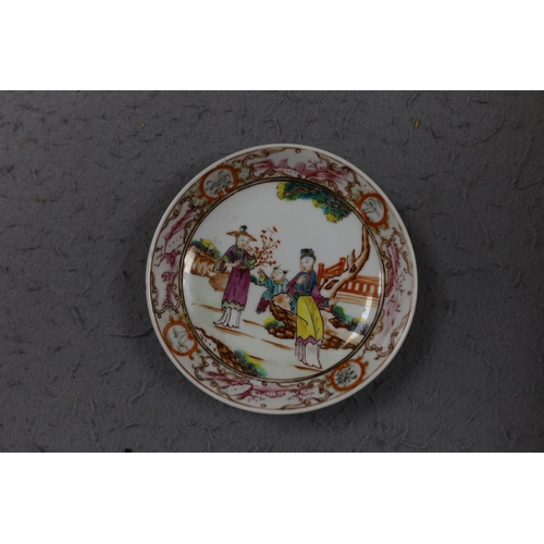 559 - A group of four 18th century Chinese export famille rose saucers,