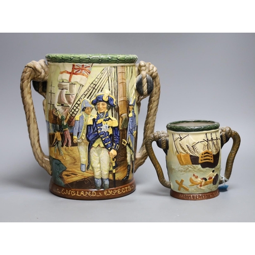 579 - A Royal Doulton Nelson commemorative loving cup, no.453/600, 27cm tall, together with another cup... 