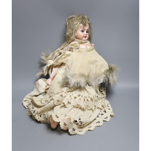 581 - A late 19th century German bisque head doll, impressed mark 300/9, 53cm