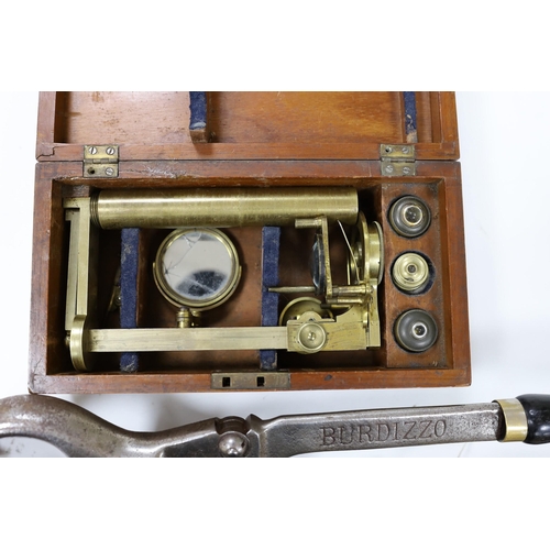 584 - A mahogany cased microscope and a pair of Burdizzo tail dockers,40cms long,