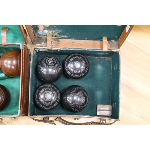 586 - A set of four Slazengers bowls balls and another set of four Douglas Kenn ltd. Henselite bowls bal... 