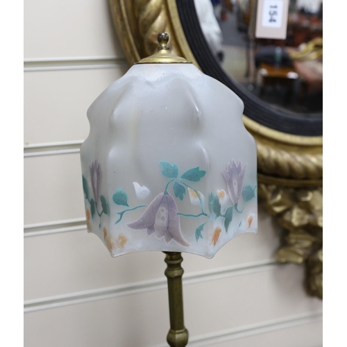 587 - A brass Pullman lamp, glass shade