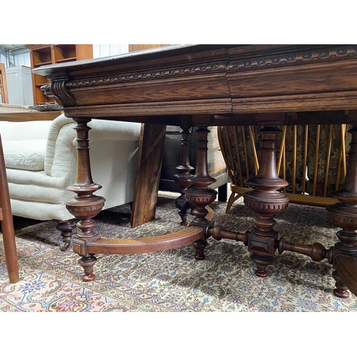 74 - A late 19th / early 20th century French oak extending dining table, (one spare leaf) length 125cm, d... 