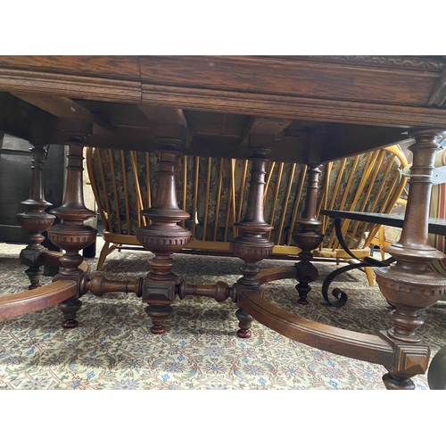 74 - A late 19th / early 20th century French oak extending dining table, (one spare leaf) length 125cm, d... 