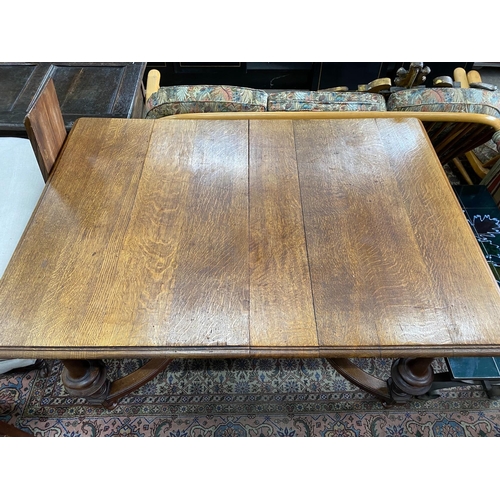 74 - A late 19th / early 20th century French oak extending dining table, (one spare leaf) length 125cm, d... 