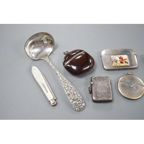 809 - Four assorted early 20th century silver vesta cases, including a silver gilt mounted nut, and patent... 