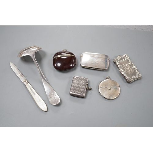 809 - Four assorted early 20th century silver vesta cases, including a silver gilt mounted nut, and patent... 