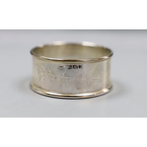 818 - A cased set of six modern silver napkin rings and one other pair of engine turned silver napkin ring... 