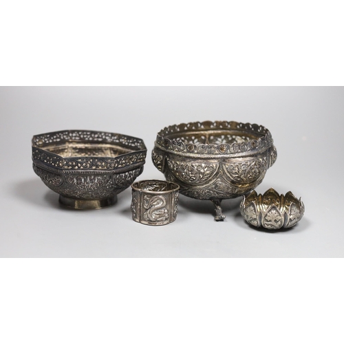 819 - Two early 20th century Indian repousse white metal bowls, widest 12cm, a similar small dish and a sa... 