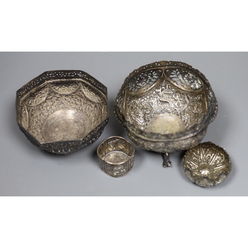 819 - Two early 20th century Indian repousse white metal bowls, widest 12cm, a similar small dish and a sa... 