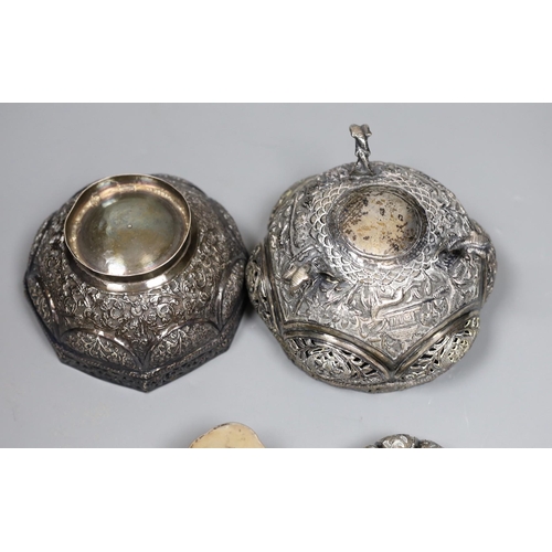 819 - Two early 20th century Indian repousse white metal bowls, widest 12cm, a similar small dish and a sa... 