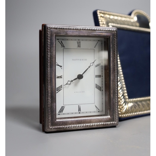 822 - Two modern silver mounted photograph frames and a similar silver mounted Mappin & Webb timepiece, 10... 