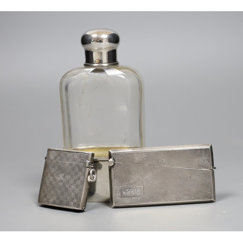 829 - A German 800 standard white metal mounted glass hip flask, 14cm, a George V silver vesta case and a ... 