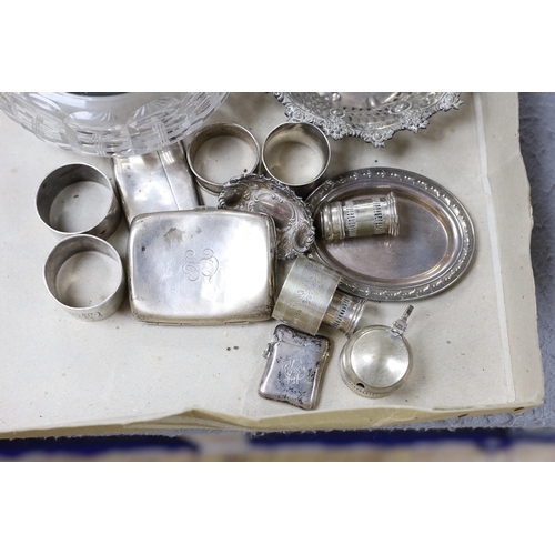 830 - A George V silver mounted glass bowl and cover and other sundry silver including napkin rings, vesta... 