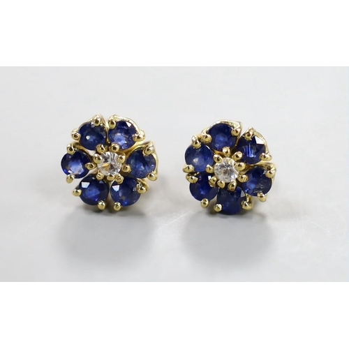 882 - A pair of yellow metal, sapphire and diamond set flower head cluster earrings, 9mm, gross weight 3.7... 