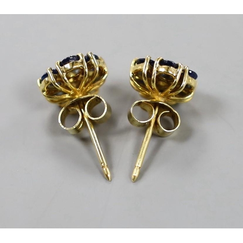 882 - A pair of yellow metal, sapphire and diamond set flower head cluster earrings, 9mm, gross weight 3.7... 