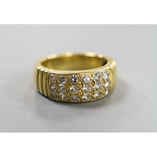 883 - A yellow metal and eighteen stone pave set diamond ring, size Q/R, gross weight 10.7 grams.