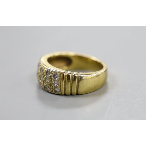 883 - A yellow metal and eighteen stone pave set diamond ring, size Q/R, gross weight 10.7 grams.