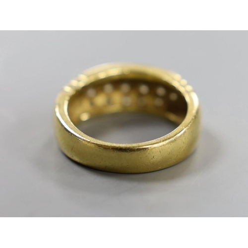 883 - A yellow metal and eighteen stone pave set diamond ring, size Q/R, gross weight 10.7 grams.