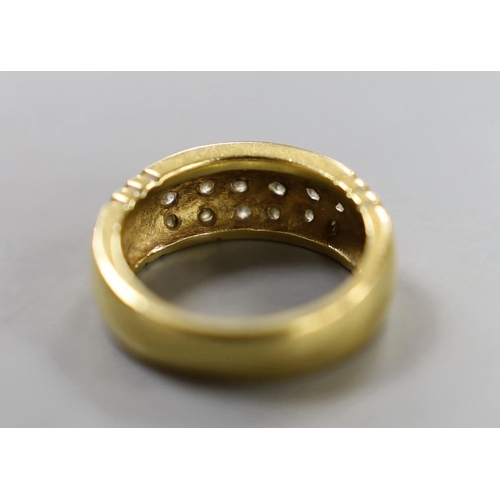 883 - A yellow metal and eighteen stone pave set diamond ring, size Q/R, gross weight 10.7 grams.